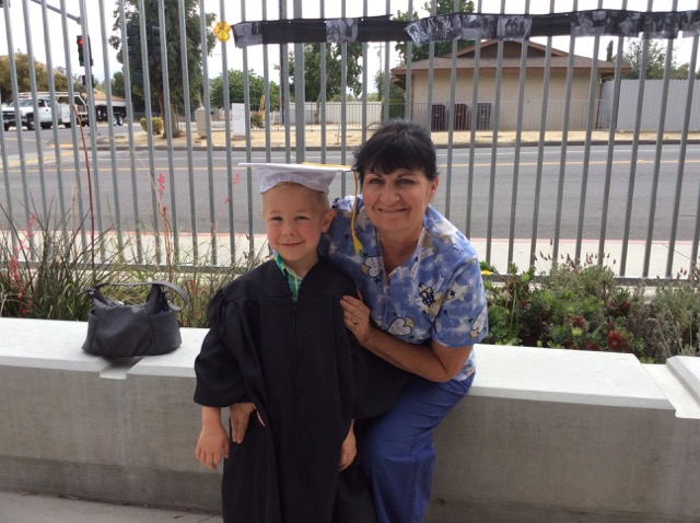 A photo of Hiatt and Grandma at pre-school graduation